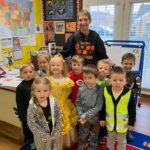 a group of preschool children with a teacher