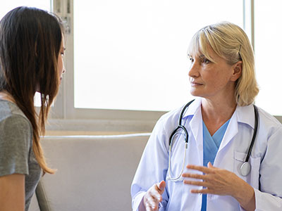 a doctor talking to a woman