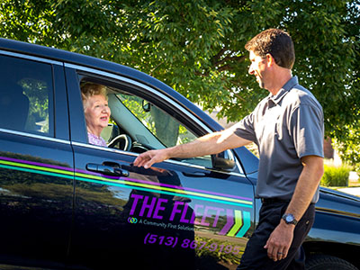 The Fleet transportation driver talking to a passenger