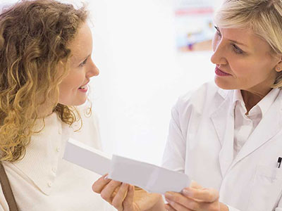 a pharmacist talking with a girl