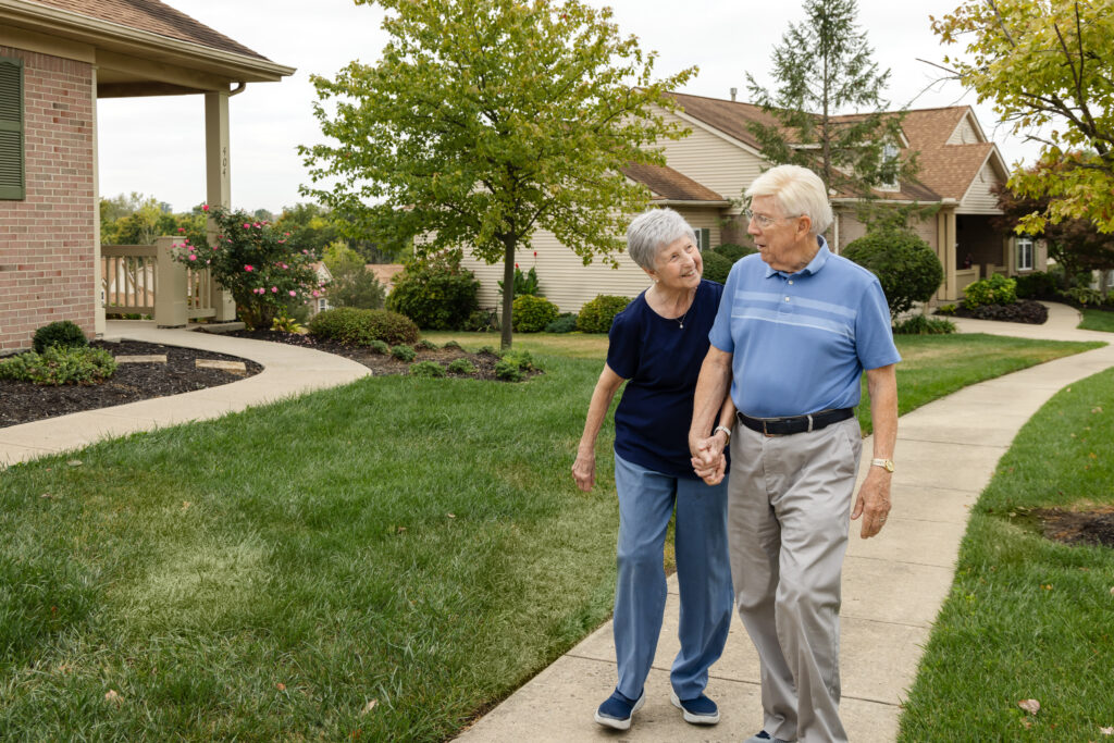 Community First Solutions sycamore glen older couple walking houses
